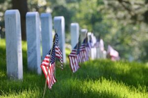 A photo of American flags decorating the headstones at Arlington National Cemetery on Memorial Day.