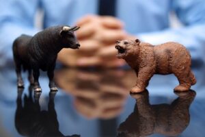 A conceptual image showing figures of a bear and a bull.