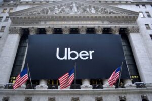 A photo of the Uber sign hanging on the New York Stock Exchange for its tech investing IPO.
