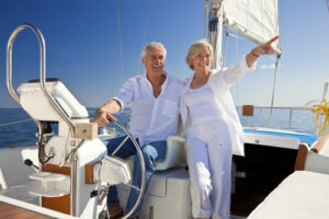 A senior couple enjoys retirement on their boat