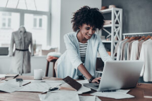 A photo showing a young woman working hard at her job.