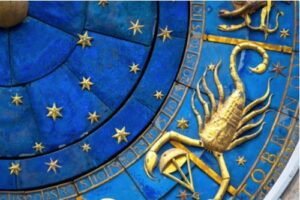 A photo showing the detail on an ancient astrological clock with zodiac signs.