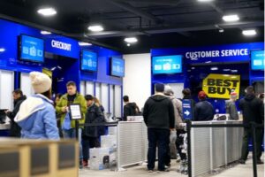 A photo showing a long checkout line at a Best Buy store during the holiday shopping season.