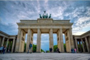 A photo of the Brandenburg Gate in Berlin at sunset.