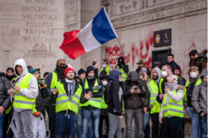 A photo showing French citizens protesting near the Arc de Triomphe during the “yellow vest” protests in December 2018.