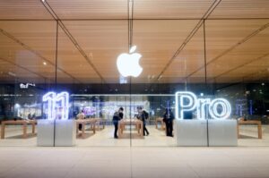 A photo of an Apple store in Taipei, Taiwain displaying a bright sign advertising the iPhone 11 Pro.