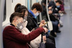 A photo showing subway passengers in Wuhan, China, wearing surgical masks to protect against the novel coronavirus.