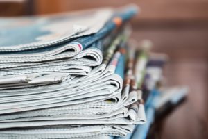 A photo of a large stack of newspapers.