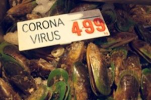 A photo showing mussels at a Chinese wet market with a sign reading “Coronavirus 4.99.”