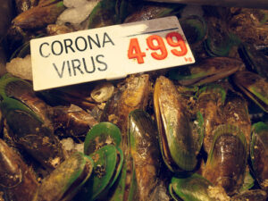 A photo showing mussels at a Chinese wet market with a sign reading “Coronavirus 4.99.”