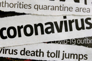 A photo showing various newspaper headlines about the coronavirus pandemic.