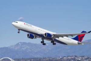 A photo showing a Delta Air Lines plane taking off for a flight.