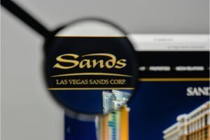 A photo showing a magnifying glass over the Las Vegas Sands logo.