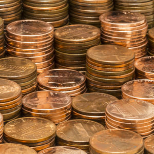 A photo showing many stacks of U.S. pennies at varying heights.