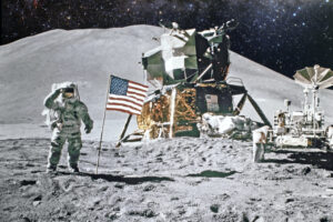 An image of an astronaut on the moon next to an American flag.