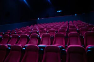 A photo showing an entirely empty movie theater with many rows of seats.