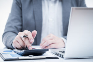 A man calculates his expenses and manages his money