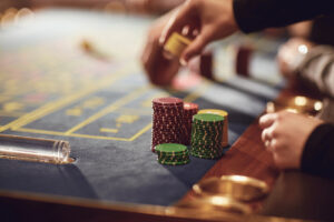 A person makes a bet at a roulette table