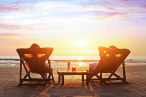 A couple relaxes on the beach