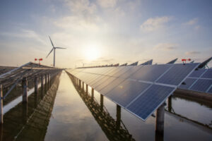 Solar panels and a wind turbine, two forms of clean energy