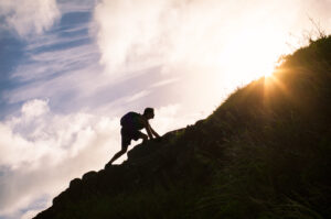 A man climbs a mountain