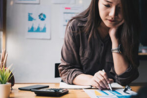 A woman calculates her taxes