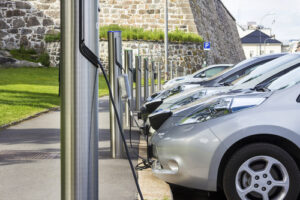 A line of electric cars at a recharging station