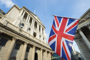 A Union Jack flag flies in front of the Bank of England in London