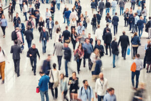 A crowd of people in a shopping center