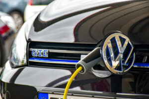 A Volkswagen Golf is charged at a charging station