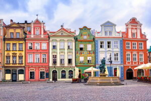 A photo of colorful Renaissance buildings in a market square in Poland.