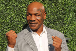 Former boxing champion Mike Tyson poses in his signature boxing stance.