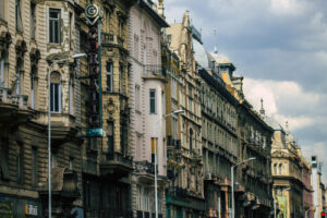 A long row of ancient historical buildings in Budapest, the capital of Hungary.