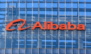 A photo of Alibaba Group Holding’s orange logo on the side of an office building.