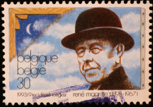 A photo of René Magritte on a Belgium postage stamp.