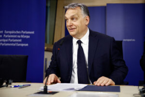 Hungarian Prime Minister Viktor Orbán smiles at a press conference during the end of the European People's Party (EPP) political assembly at the European Parliament.