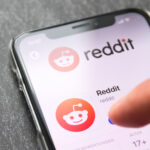 I-phone user downloads the Reddit app onto their phone.