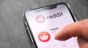 I-phone user downloads the Reddit app onto their phone.