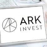 The logo for Cathie Wood’s company, Ark Invest, on a white tablet screen.
