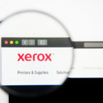 A snapshot of Xerox’s website with a magnifying glass.
