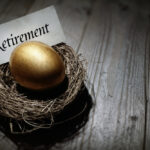 A nest holding a golden egg with the word “retirement” on a piece of paper.
