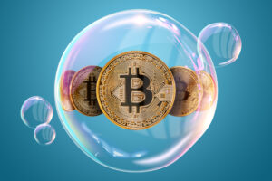 A group of gold Bitcoins inside of a bubble.