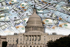 The Capitol Building in Washington, D.C., in front of multiple hundred-dollar bills.