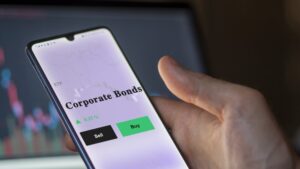 The corporate bonds ETF on a phone screen with the words “buy” and “sell” on buttons underneath.