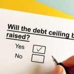 A ballot asking, “Will the debt ceiling be raised?” with “yes” and “no” underneath with a check mark next to “yes.”