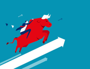 A businessman riding on the back of a bull as it trends upward.