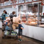A family in line at Costco ordering food.