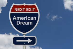 A road sign that says, “Next Exit: American Dream.”