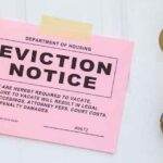 An eviction noticed taped to a front door.
