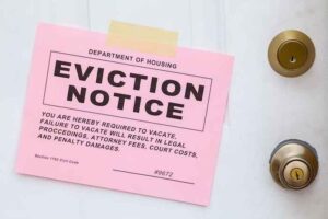 An eviction noticed taped to a front door.